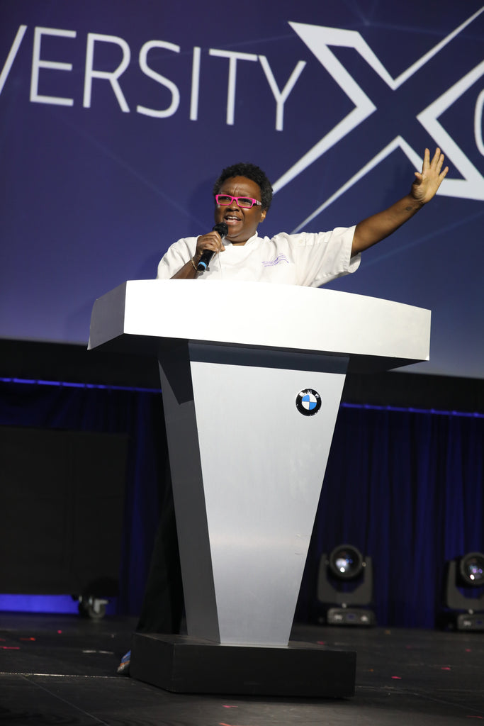 Chef Maria at 2023 BMW Supplier Diversity Xchange podium